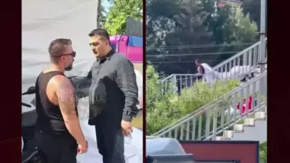 Cumhurbaşkanı'nın afişini sökerken yakalanan şahsa belediye çalışanları müdahale etti