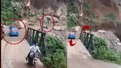 Hindistan'da meydana gelen heyelanda  motosikletlei ölümden kıl payı kurtuldu